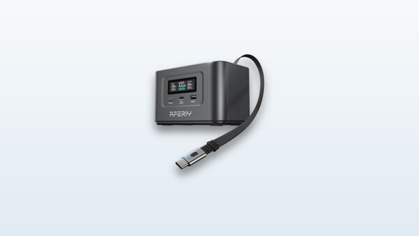 Aferiy Nano100 power bank shown from the side, screen displaying 100% charge, retractable USB-C cable extended