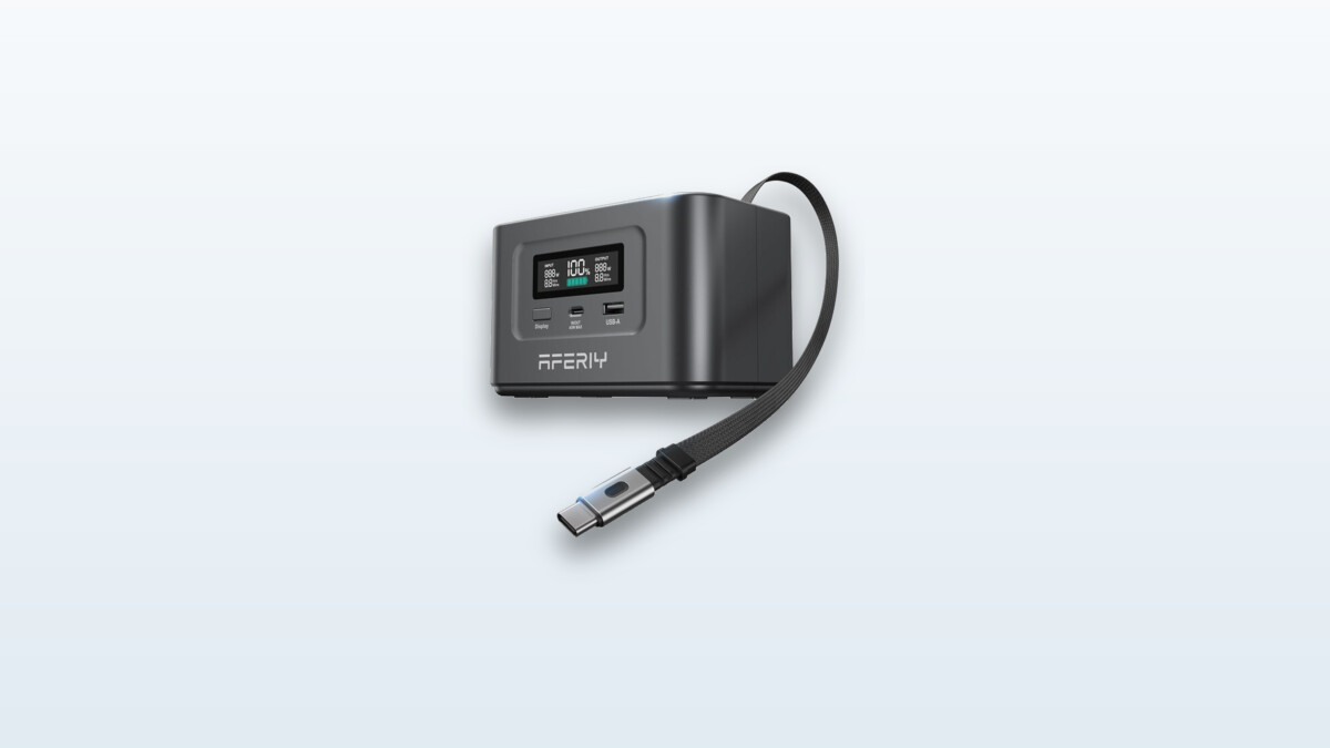 Aferiy Nano100 power bank shown from the side, screen displaying 100% charge, retractable USB-C cable extended