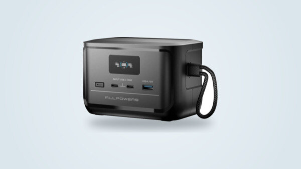 Allpowers Solax P100 portable power station at a three-quarter angle, lit LCD screen, two USB-C ports and one USB-A port visible