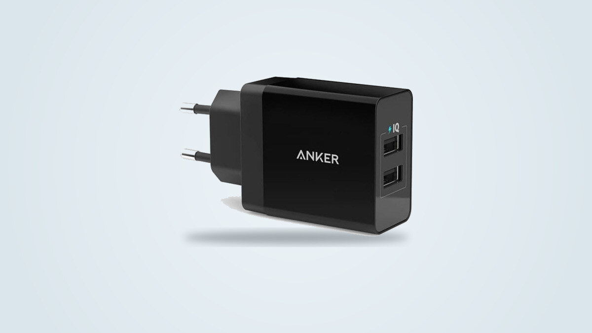 Black Anker dual USB-A wall charger seen from a three-quarter angle, European prongs unfolded