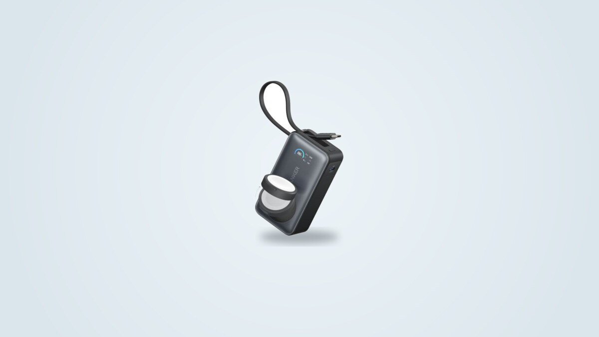 Anker MagGo Apple Watch 10000 power bank at a three-quarter angle, built-in USB-C cable looped and the Apple Watch charging puck tilted open
