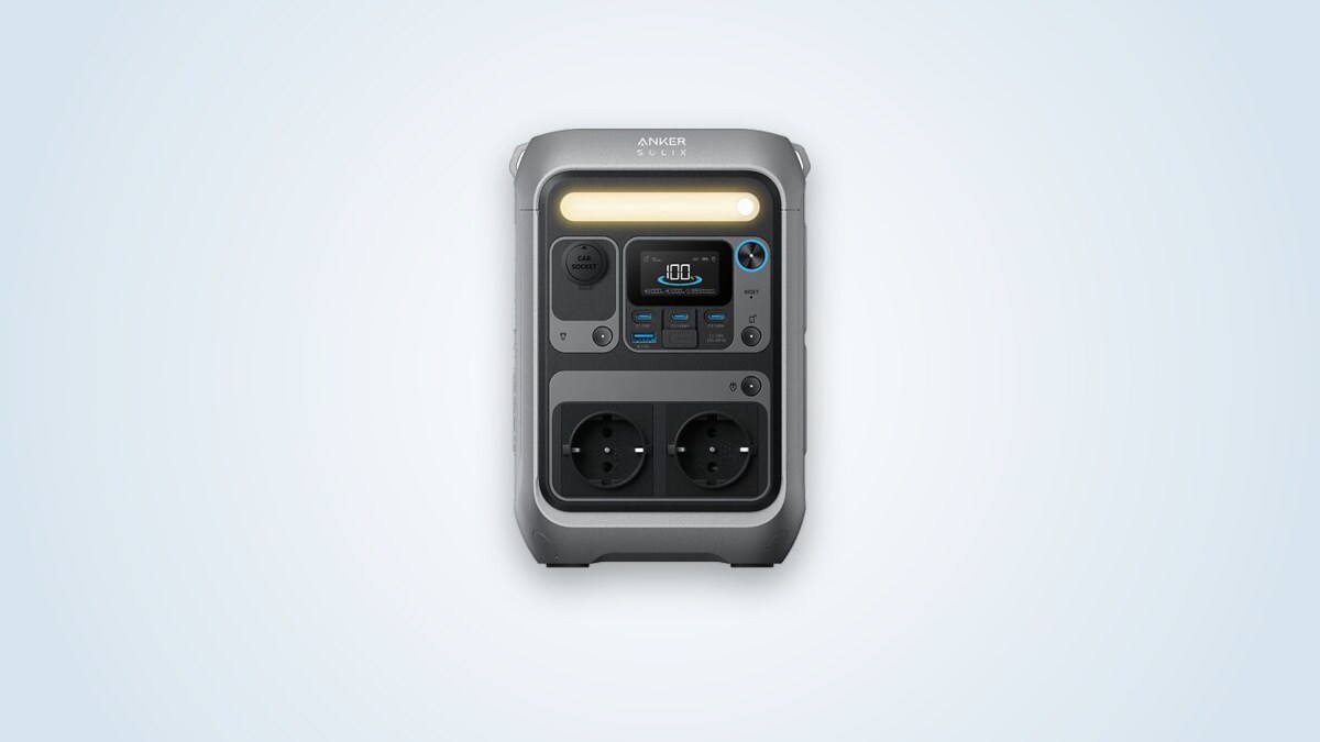 Anker Solix C300 portable power station at three-quarter angle, screen lit, 230 V sockets and USB-C ports visible