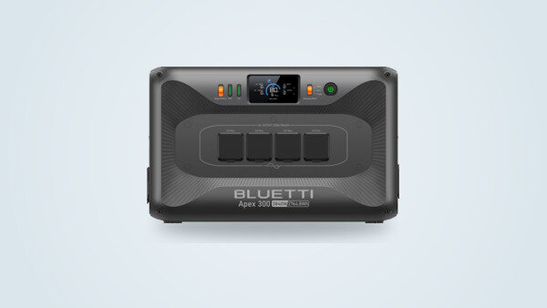 Bluetti Apex 300 portable power station seen from the front, screen lit, four AC outlets under rubber covers and the 3840W 2764.8Wh marking