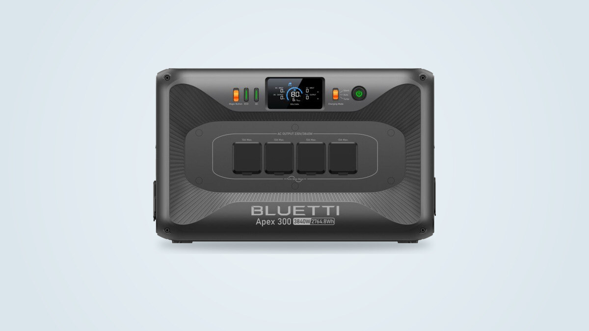 Bluetti Apex 300 portable power station seen from the front, screen lit, four AC sockets under rubber covers and the 3840W 2764.8Wh marking