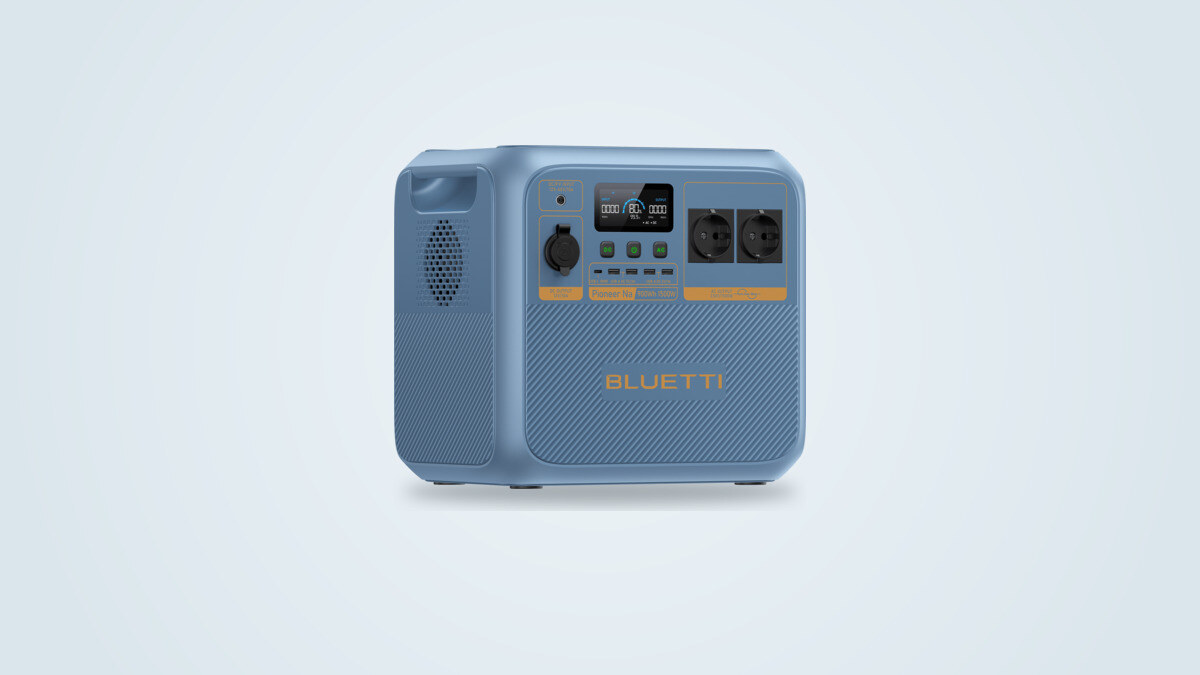 Bluetti Pioneer Na portable power station at a three-quarter angle, screen lit showing 80% and two European mains sockets visible