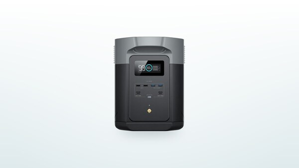 EcoFlow Delta 2 Max power station sitting on the floor, LCD screen showing the charge level