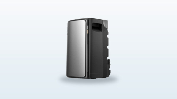 EcoFlow Stream Ultra hybrid solar battery placed on the ground, with a solar panel connected in the background