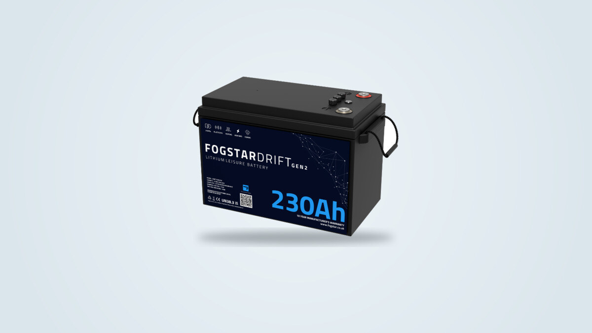 Fogstar Drift 12V 230Ah LiFePO4 Gen2 battery seen from three quarters, black case with carry handles and a white indicator light on the front panel