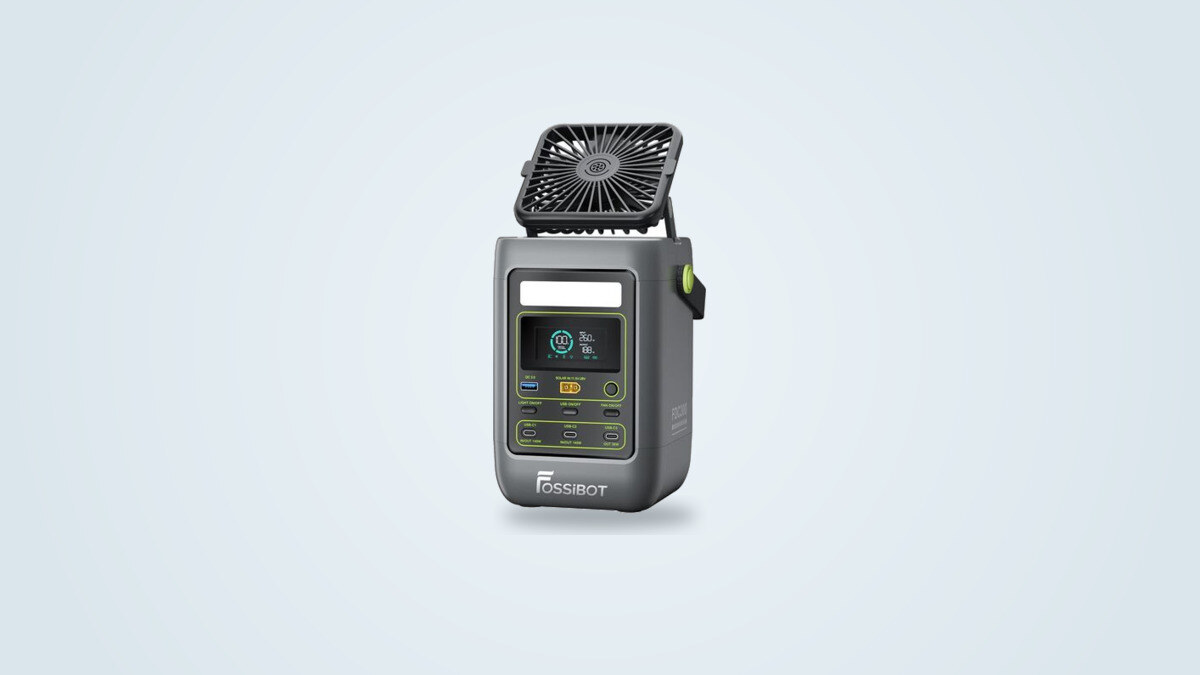 Fossibot FDC300 power station at a three-quarter angle, personal fan deployed and screen showing charge status