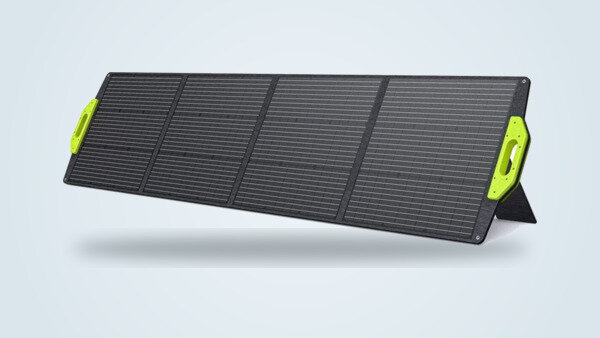 Fossibot SP200 foldable solar panel deployed at an angle, its four monocrystalline panels and bright green end handles visible