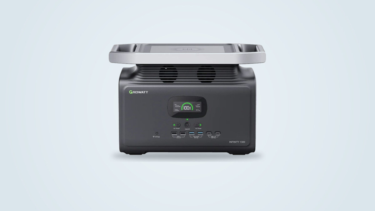 Growatt Infinity 1300 portable power station seen from the front, LCD screen lit, wireless charging pad and USB ports visible