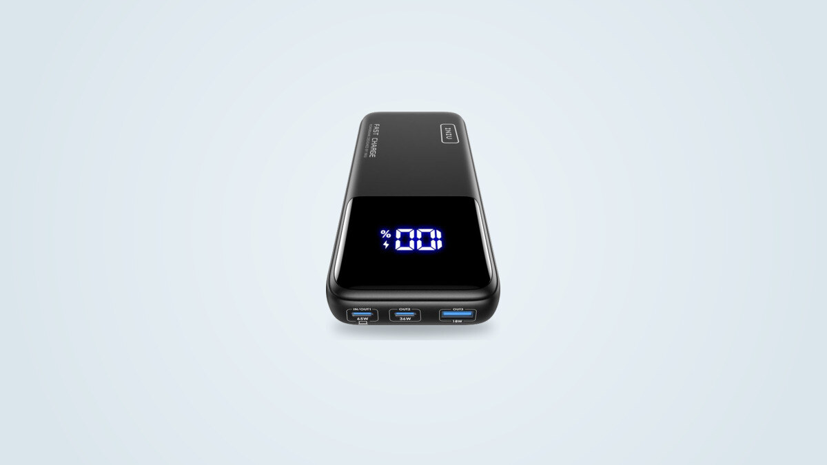 INIU 20,000mAh 65W power bank seen from the front, digital screen showing the charge percentage, three ports IN/OUT1 65W, OUT2 36W and OUT3 18W visible at the bottom of the case