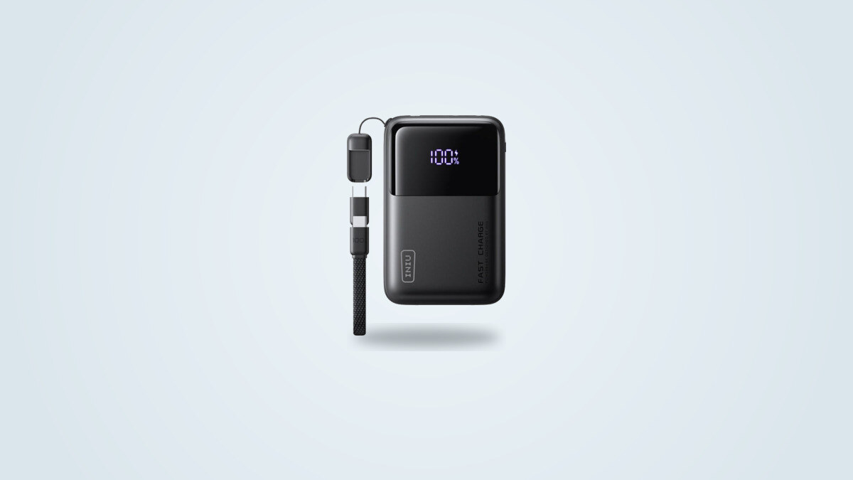 INIU P63 power bank seen from the front, digital display showing 100%, detachable USB-C cable coiled on the left side of the case