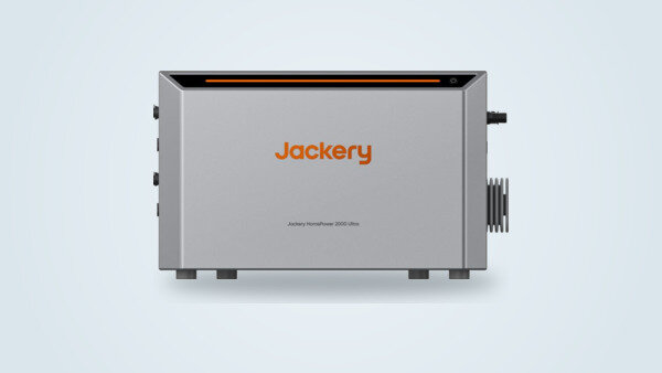 Jackery HomePower 2000 Ultra seen from the front, gray enclosure with an orange light strip and brand logo