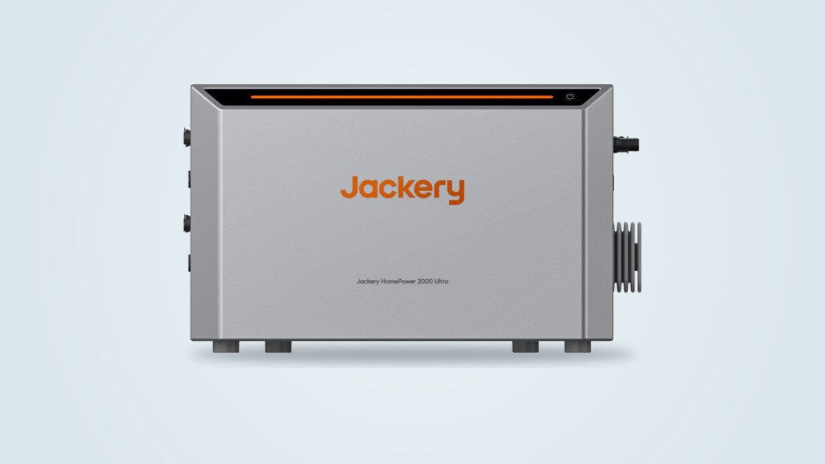 Jackery HomePower 2000 Ultra seen from the front, gray enclosure with an orange light strip and brand logo