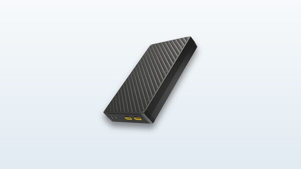 Nitecore NB20000 Gen 3 carbon-fiber power bank shown in profile, with its two USB-C ports visible