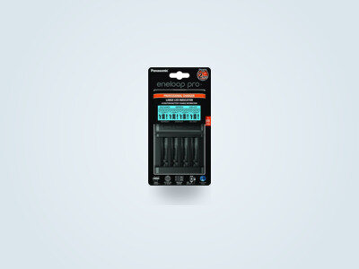 Panasonic Eneloop Pro BQ-CC65 battery charger with LCD screen on a light background