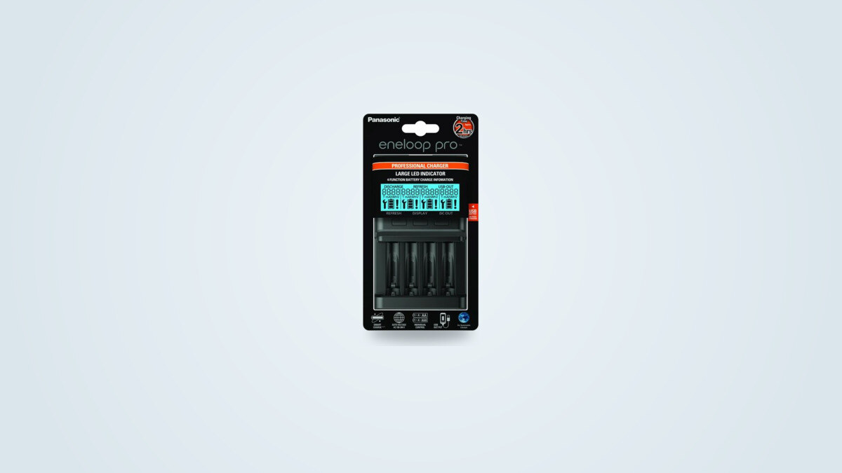 Panasonic Eneloop Pro BQ-CC65 battery charger with LCD screen on a light background