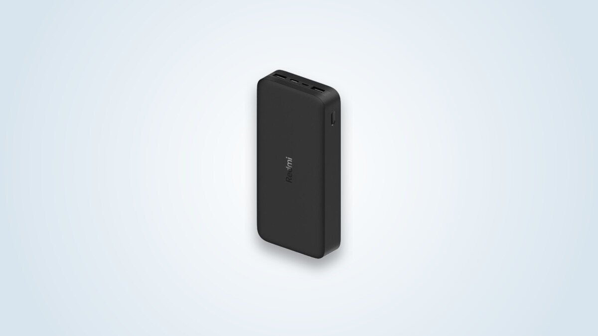 Black Redmi 20000mAh external battery, with two USB-A ports and one input port, Redmi logo visible on the edge