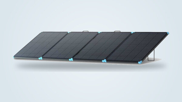 Renogy 400W Lightweight Solar Suitcase deployed on its adjustable kickstands, four monocrystalline panels visible from a three-quarter angle on a light gradient background