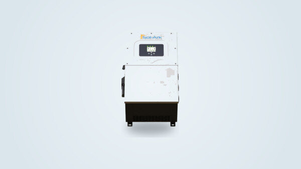 Sol-Ark 15K hybrid inverter mounted on the wall of a utility room, touchscreen and connectors visible