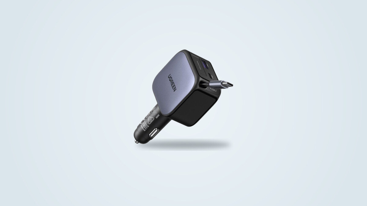 Ugreen 90W car charger seen from a three-quarter angle, retractable USB-C cable partly extended, with the USB-C and USB-A ports visible on the side