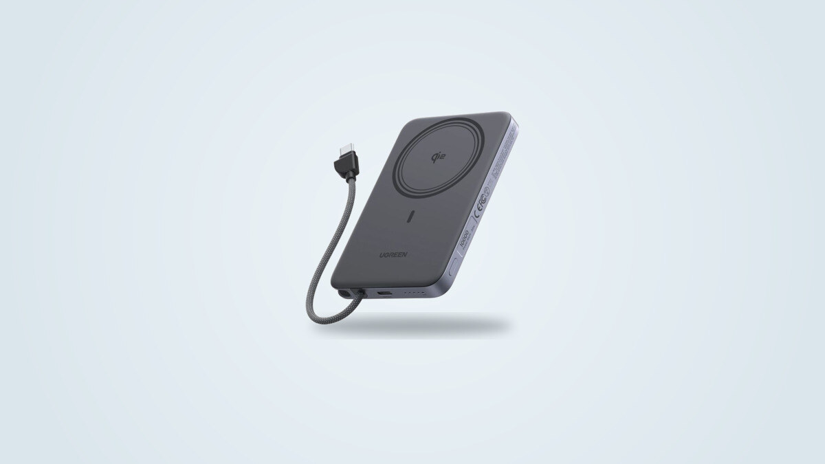 Gray Ugreen MagFlow Air 10000mAh magnetic power bank in three-quarter view: Qi2 ring on the back and the built-in braided USB-C cable pulled out in a loop that works as a lanyard