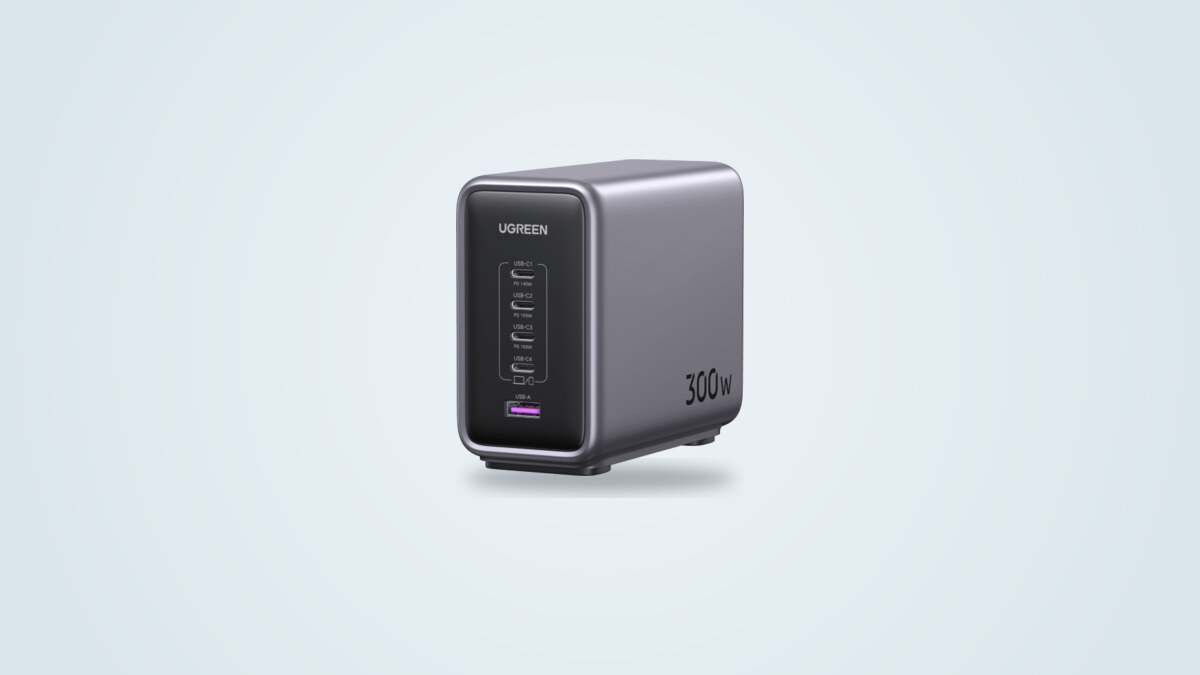 Ugreen Nexode 300W desktop charger seen from a three-quarter angle, five ports visible on the black front panel