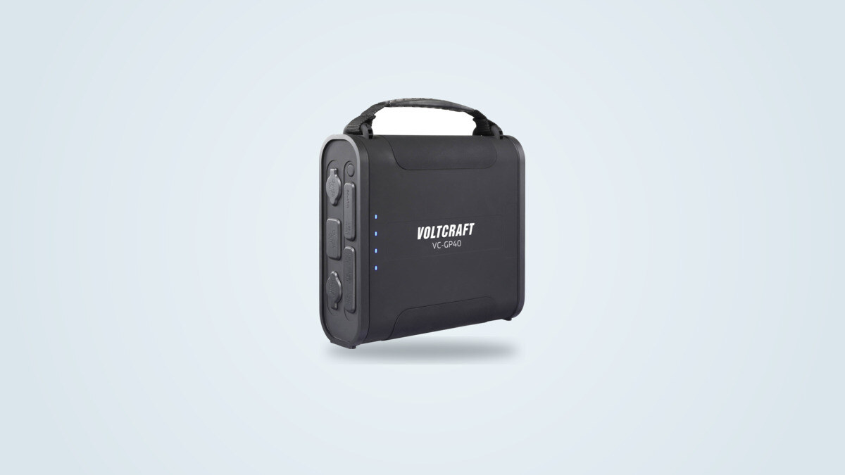Voltcraft VC-GP40 power bank shown at a three-quarter angle, carry handle and 12 V, USB-C and USB-A ports visible on the left edge