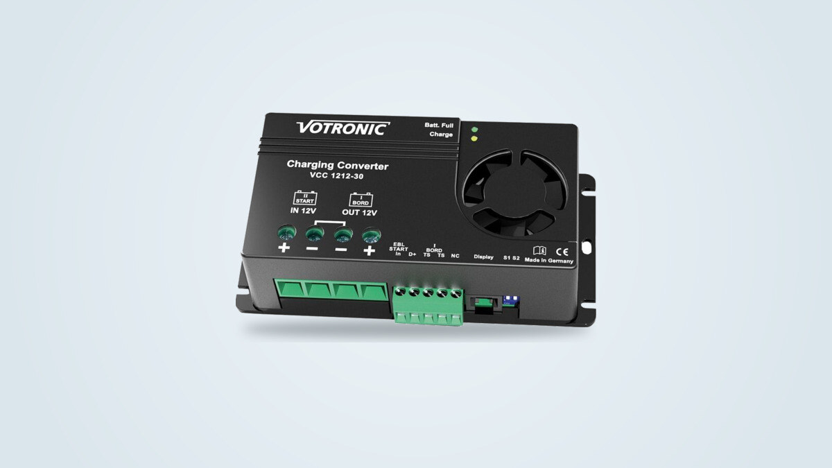 Votronic VCC 1212-30 DC-DC charger seen from a three-quarter angle, with its fan and connection terminals visible