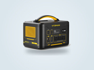 Vtoman Jump 2200 portable power station from a three-quarter angle, screen lit up, three mains sockets visible