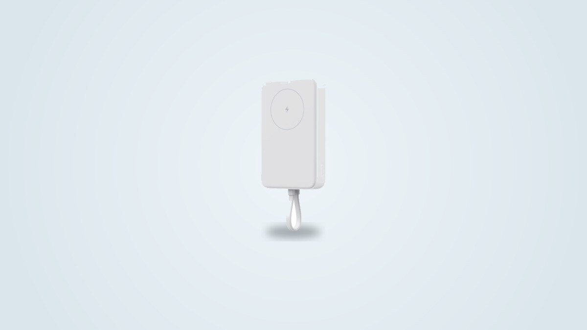 Xiaomi 33W Magnetic Power Bank 10000 attached to the back of a smartphone, built-in USB-C cable extended