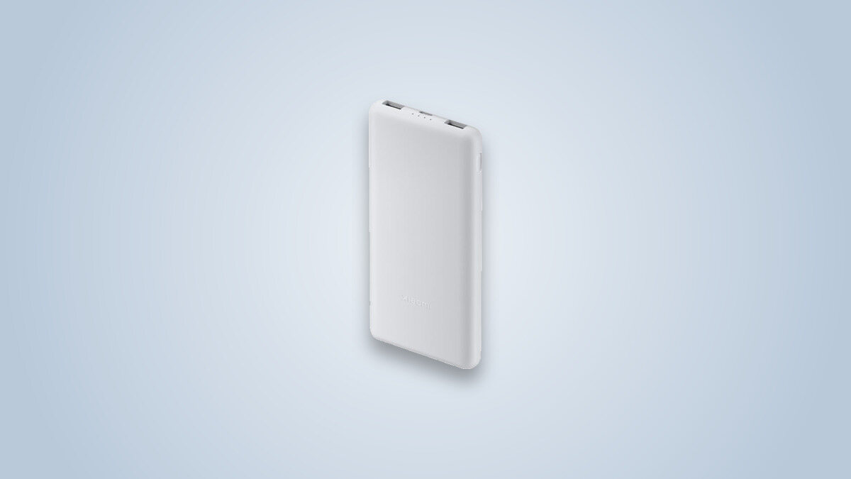 White Xiaomi Power Bank 10000 Lite external battery, two USB ports visible at the top of the casing
