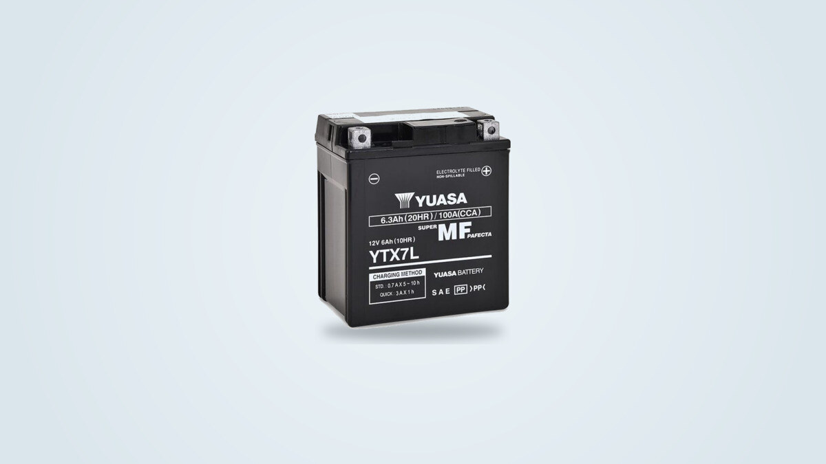 Yuasa YTX7L-BS AGM motorcycle battery seen from three-quarters on a light background, label showing 12 V 6.3 Ah 100 A